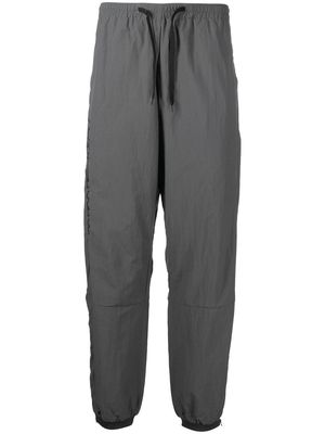 Liberaiders logo-embroidered track pants - Grey