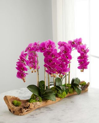 Log Filled with Faux Fuchsia Orchids