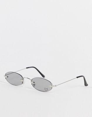 Madein. Y2K slim oval sunglasses with diamante heart detail in gray-Silver