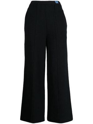 Maison Mihara Yasuhiro exposed-seam knitted trousers - Black