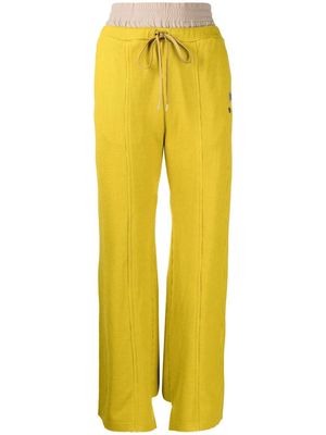Maison Mihara Yasuhiro logo-patch flared trousers - Yellow