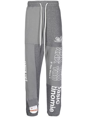 Maison Mihara Yasuhiro slogan-print track-pants - Grey