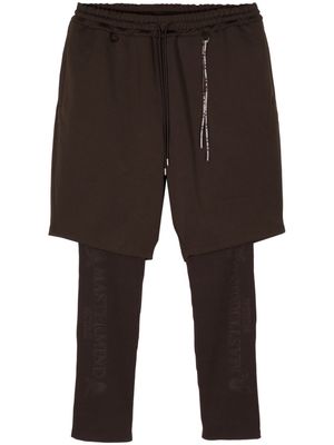 Mastermind World logo-debossed layered trousers - Brown