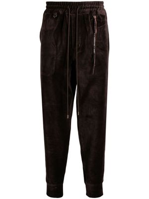 Mastermind World tapered velour track pants - Brown