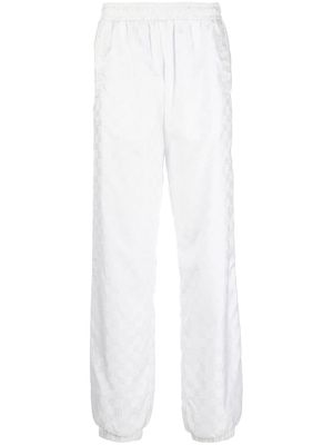 MISBHV monogram-print elasticated-waist track pants - White