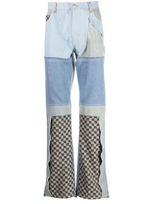 MISBHV upcycled monogram-patchwork jeans - Blue