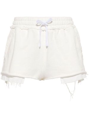 Miu Miu logo-embroidered distressed cotton track shorts - White