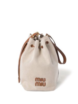 Miu Miu logo-lettering canvas bucket bag - Neutrals