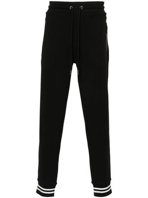 Moncler logo-patch jersey trousers - Black