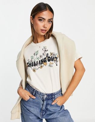 Monki chilling out placement print T-shirt in beige-Neutral