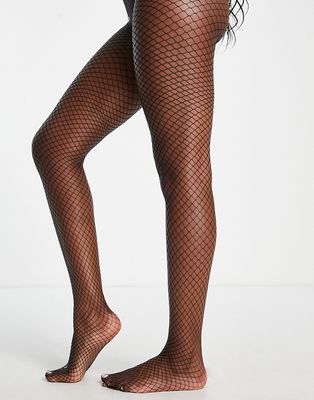 Monki fishnet tights in black