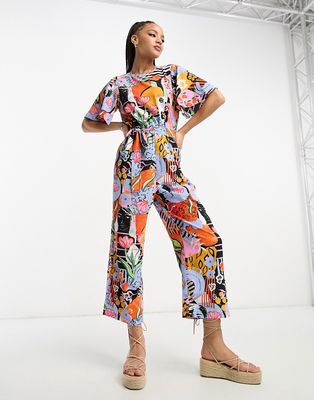 Monki flutter sleeve tie waist jumpsuit in collage art print-Multi