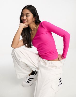 Monki long sleeve one shoulder top in bright pink