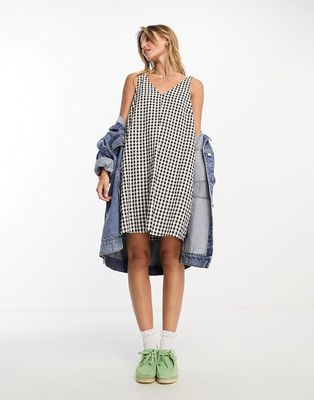 Monki seersucker bow tie strap mini dress with side pockets in black and white gingham-Multi