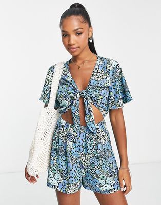 Monki tie front romper in blue ditsy floral