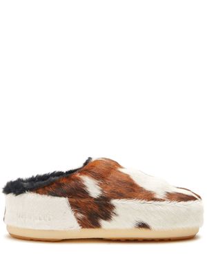 Moon Boot cow-print pony hair mules - White