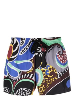 Moschino all-over graphic-print swim shorts - Blue