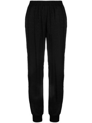 Moschino all over logo-print track trousers - Black
