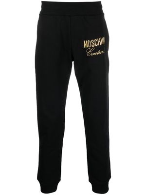 Moschino appliqué logo track pants - Black