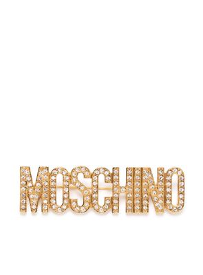 Moschino crystal-embellished logo brooch - Gold