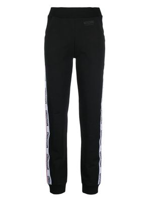 Moschino embossed-logo jersey trousers - Black