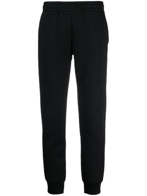 Moschino flocked-logo elasticated-waist track pants - Black
