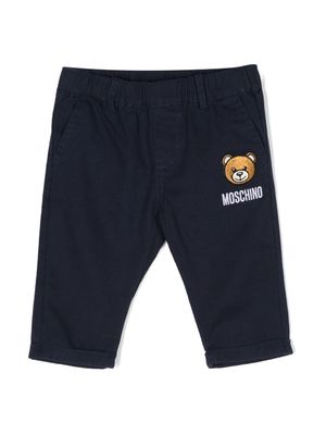 Moschino Kids Leo Teddy-appliqué tapered trousers - Blue