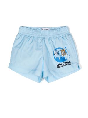 Moschino Kids logo-print slip-on swim shorts - Blue