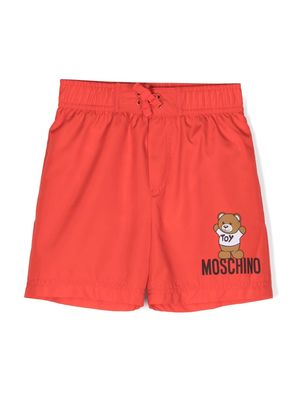 Moschino Kids logo-print swim trunks - Red
