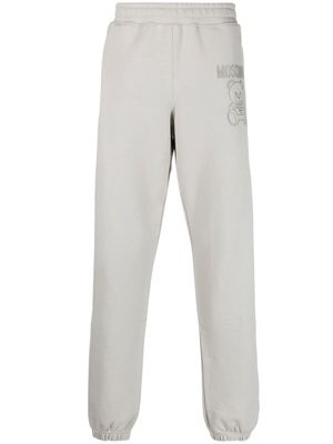 Moschino logo-appliqué track pants - Grey