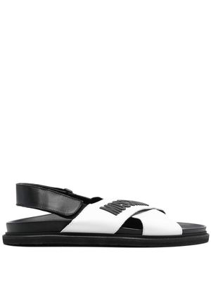 Moschino logo-embossed criss-cross sandals - White