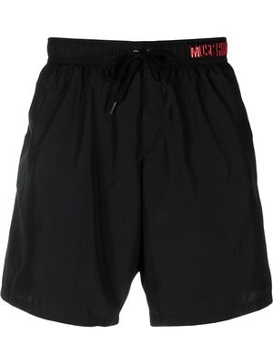 Moschino logo-lettering swim shorts - Black