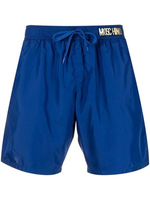 Moschino logo-lettering swim shorts - Blue