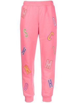 Moschino logo-lettering track pants - Pink