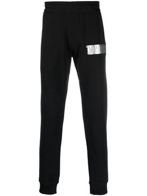 Moschino logo-patch tapered sweatpants - Black