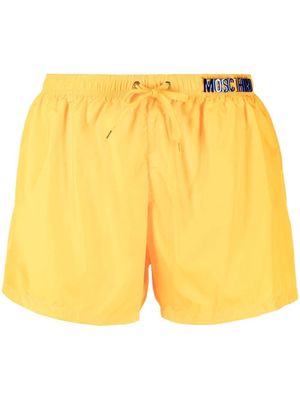 Moschino logo-plaque detail swim shorts - Yellow