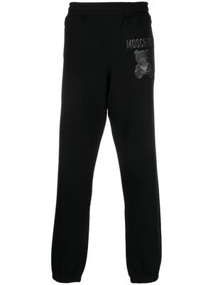 Moschino logo-print organic cotton track pants - Black