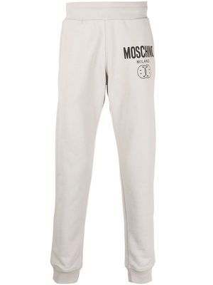Moschino logo print tapered sweatpants - Grey