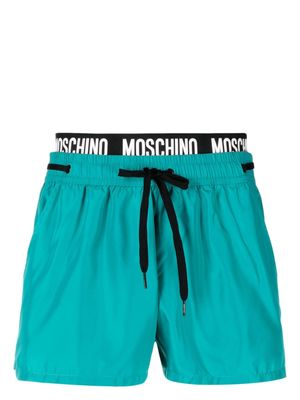 Moschino logo-waistband beach shorts - Green