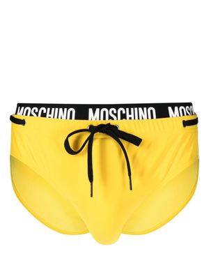 Moschino logo-waistband drawstring swim trunks - Yellow