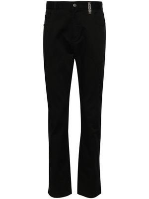 Moschino mid-rise logo-engraved straight-leg jeans - Black