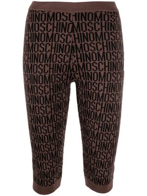 Moschino monogram-print knitted leggings - Brown