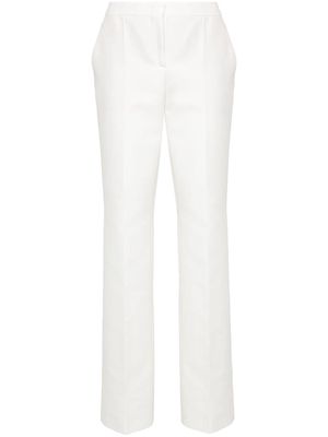 Moschino patch-detail cotton trousers - White