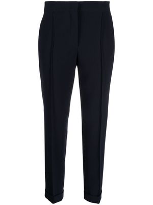 Moschino pressed-crease concealed-fastening tapered trousers - Blue