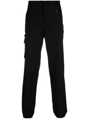 Moschino rubberised-logo tailored trousers - Black