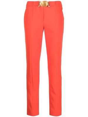Moschino Smiley-buckle tapered trousers