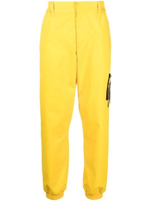 Moschino tapered stretch-cotton trousers - Yellow
