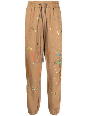 Mostly Heard Rarely Seen Warped paint-embroidered track pants - Brown