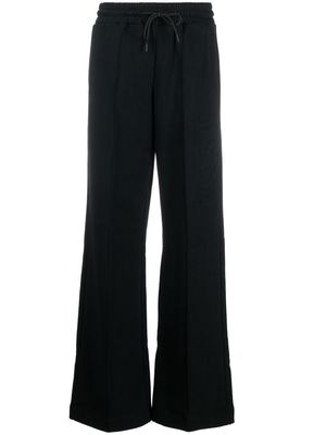 MSGM logo-embossed wide-leg track pants - Black