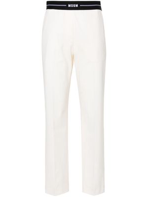MSGM logo-waistband tapered trousers - Neutrals